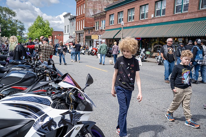 Kids walk down First Street eyeballing the bikes at the annual Snohomish Motorcycle Show held by the Sky Valley Chapter of ABATE on Sunday, May 24. Rows of bikes of all types, from slim sportbikes to fat-wheeled customs, lined downtown.