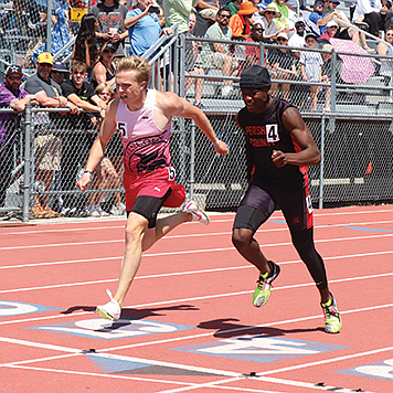 Pershing County's Angelo Gibson (right) beats Lincoln County's Tanner Bleak in a photo finish in the 800 meters at the NIAA 2A State Track and Field Championships in Carson City.