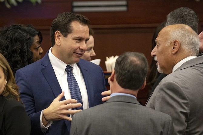 Nevada Secretary of State Cisco Aguilar, left, talks with Lt. Gov. Stavros Anthony during the opening of the 82nd session of the Nevada Legislature in Carson City on Feb. 6, 2023.