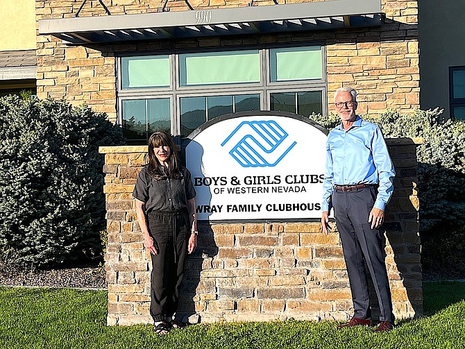 Lois Wray and Boys & Girls Clubs of Western Nevada CEO Brett Zunino stand in front of the sign of Minden’s new clubhouse The Wray Family Boys & Girls Club of Western Nevada during the unveiling May 16.