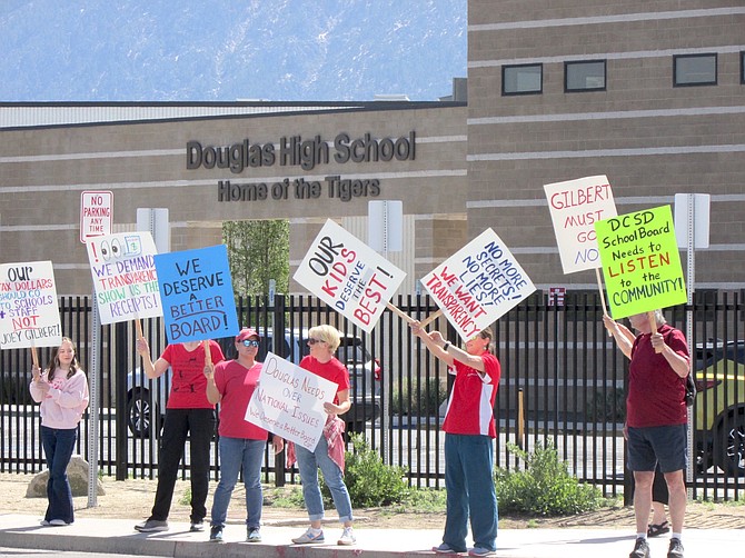 We Deserve a Better Board protesters gather outside of Douglas High School on Tuesday before the meeting.