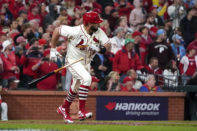 The Cardinals' Albert Pujols runs out a single against the Phillies in Game 2 of an NL wild-card playoff series in 2022.