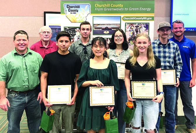 County commissioners pose with the 2024 Jim Regan Memorial Scholarship recipients. Back row, from left: Commissioner Bus Scharmann, Levi Johnson, Hailey Guerrero, Owen McIntosh and Commissioner Myles Getto. Front row, from left: Commissioner Justin Heath, Bryan Mendoza, Weina Lu and Emily Bird.