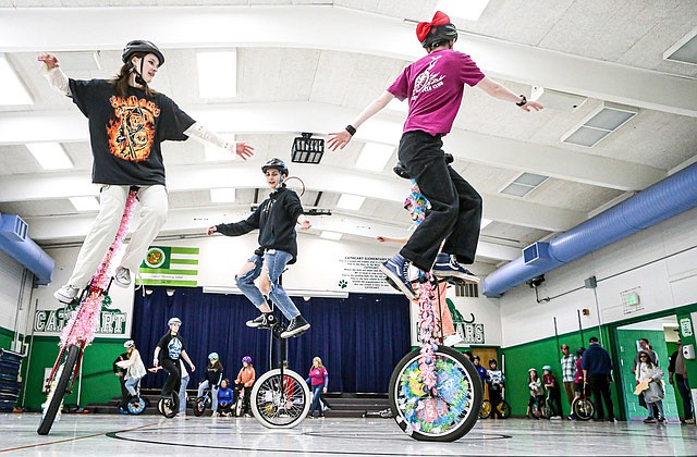 The Cathcart Unicyclists practice Friday, May 17 in the gym of Cathcart Elementary School. Everybody rides and practices, and the group of elementary to high schoolers performs in parades.