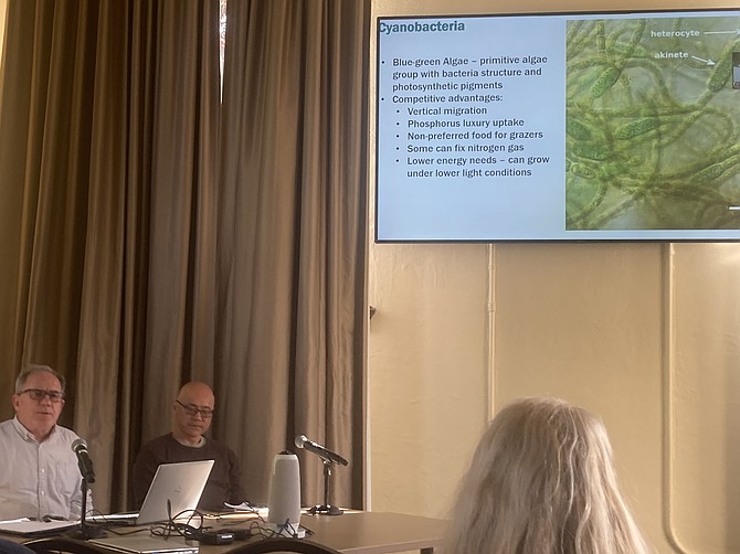 Aquatic scientist Rob Zisette (bottom left) and Snohomish City Engineer Yosh Monzaki (looking at something on the table) during the May 20 Blackman Lake cyanobacteria meeting.