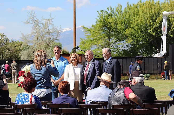 Douglas County commissioners Danny Tarkanian, Sharla Hales, Wes Rice and Walt Nowosad have their picture taken at the Vietnam Moving Wall on Friday.