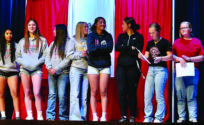 Several PCHS softball team members stand onstage at awards night at the high school. From left to right- Riley Harvey, Raegan Burrows, Miya Gallagher, Taylor Garland, Yasmine McKinney, Mady Grenz, Arya Garland and Samantha Bristow.