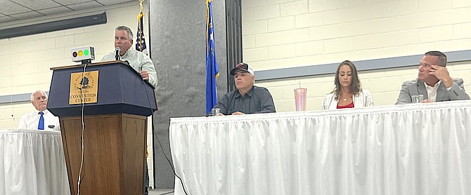 Matt Hyde, a candidate for Churchill Commission District 1, answers a question at the podium during Candidates Night. From left are candidates Rusty Jardine (District 3), Hyde, Todd Moretto (District 3), Julie Guerrero-Goetsch (District 1) and Eric Blakey (District 3).