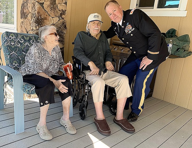 Newly-promoted Nevada Army Guard Col. Karsten Hall, right, takes time out for a photo with father Jonathan Hall and mother Ruth Hall in Carson City on June 4, 2024.