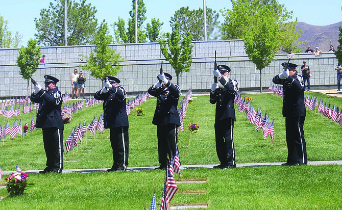 The Nevada Veterans Coalition rifle team honors those interred at the Northern Nevada Veterans Memorial Cemetery in Fernley during the Memorial Day service.