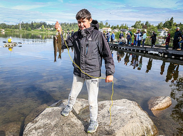 Mathias, age 13, from Snohomish shows off his catch from the Blackman Lake Kids Fishing Derby on Saturday, June 1 held by the Snohomish Sportsmen’s Club. His younger sister also caught fish. Mathias said he has been fishing since he was 11.