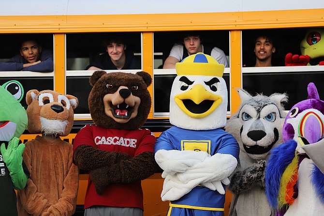 The mascots of Everett Schools, with Everett High’s Sammy the Seagull at center flanked by Cascade’s Bruin and Jackson’s Timberwolf, plus friends peering out of the bus windows.