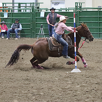 Humboldt County’s Huntley Byrd makes her way through the pole bending course.