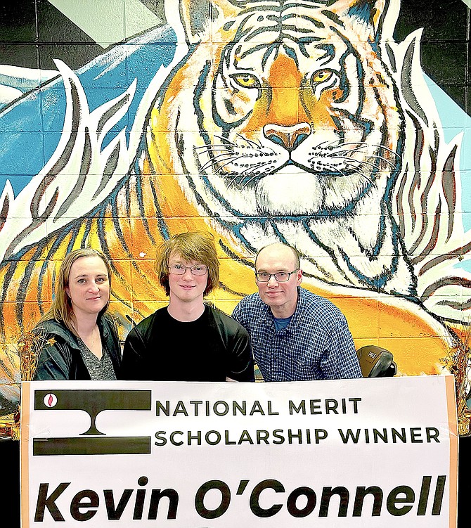 Douglas High School 2024 graduate Kevin O’Connell, center, was awarded the National Merit and accepted a full 4-year scholarship on June 5 with the University of Reno. Photo special to The R-C