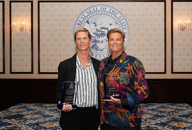 Carson High School alumna Timi Brown stands next to her sister, Jaime, for a photo after the two were inducted into the Carson High School Hall of Fame.