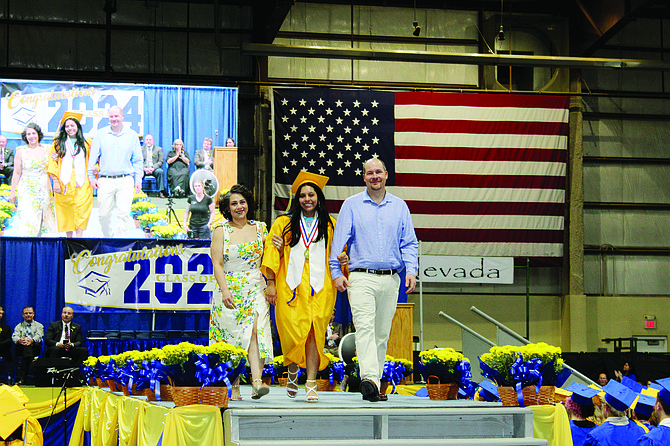 LHS Class of 2024 Salutatorian Alexis Galarza was accompanied by her mother and father.