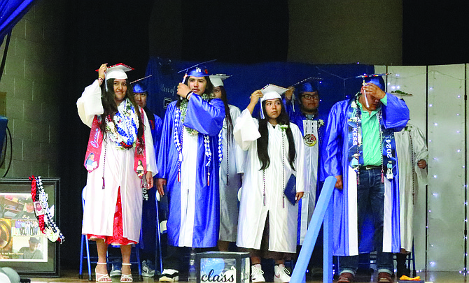 The McDermitt graduates turn their tassels as part of the ceremony.