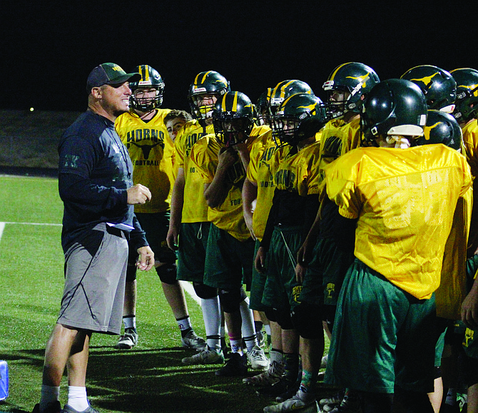 Mitch Domagala with his Longhorn football team at midnight practice.