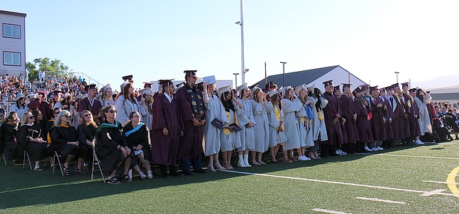 Dayton High School graduates prepare to turn their tassels after receiving their diplomas Thursday.