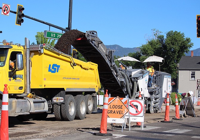 Little pieces of what used to be the pavement on Highway 395 are ground up on Thursday morning.