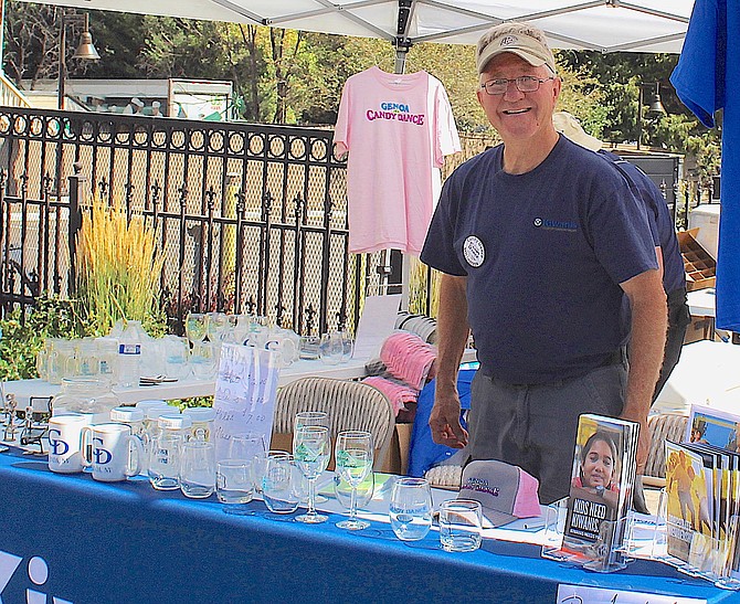 Mike Henningsen works the Kiwanis booth at the 2023 Candy Dance.