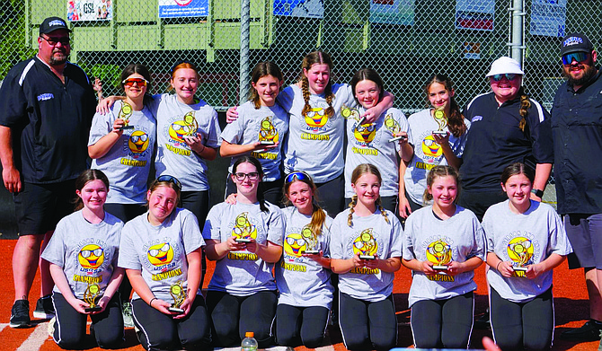 Eatonville's Bandits 14U fastpitch team poses with their trophies following their 8-4 victory to clinch the conference championship of the Thurston County Fastpitch Association.