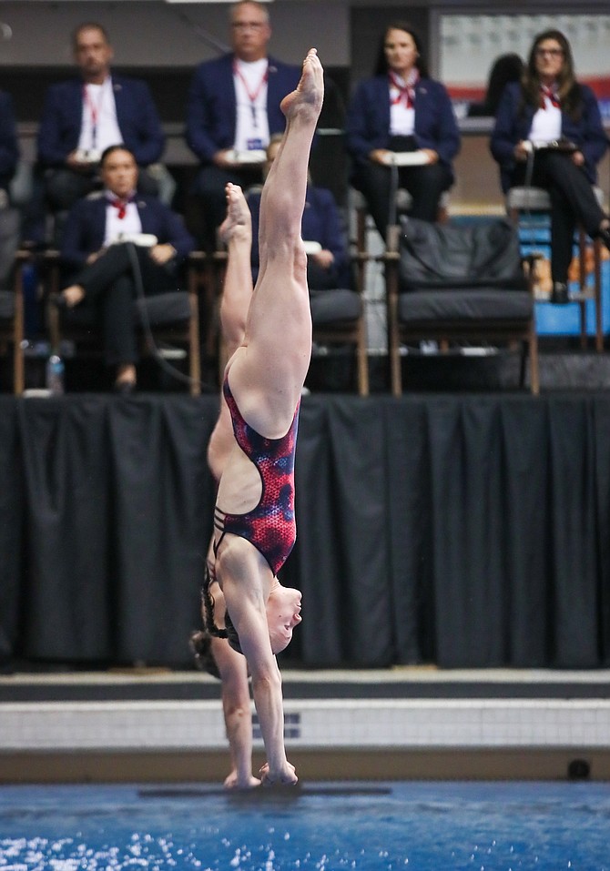 Krysta Palmer, near, finishes a dive during the synchronized competition Monday at the 2024 USA Olympic Diving Trials. Thursday afternoon, Palmer competed in the individual 3-meter springboard event where she was fourth after the semifinal. The 2020 Olympic bronze medalist will need to be top two in the individual event to qualify for another Olympic games.
