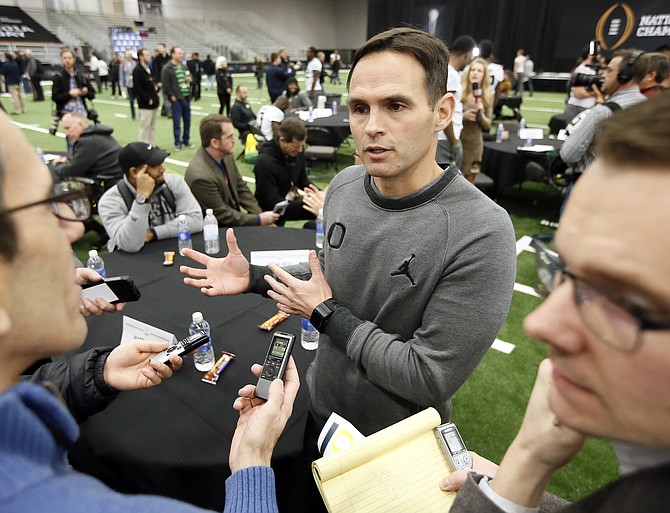 Oregon receivers coordinator Matt Lubick talks with reporters during media day for the CFP championship game in 2015. Lubick will be in charge of the Nevada offense this season.