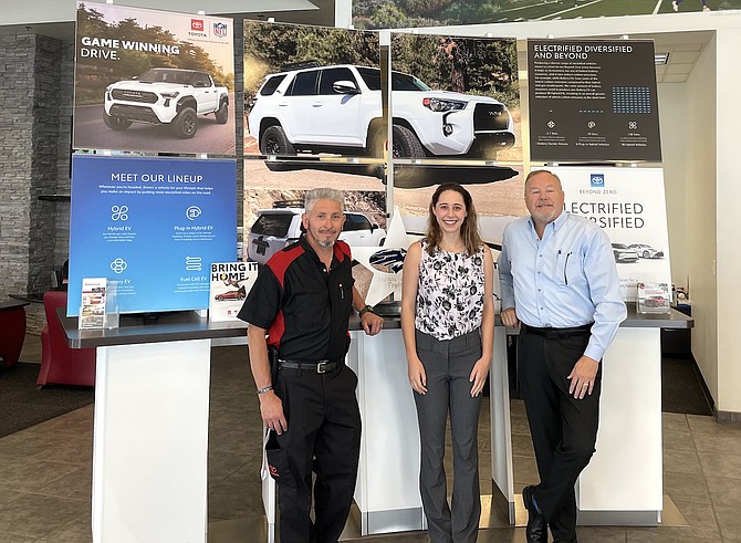 From left, Hugo Chavez of the Carson City Toyota facilities department, Erica Gallegos, program coordinator for Nevada Green Business Network, and Cliff Sorensen, director of Campagni Auto Group, at Carson City Toyota on June 25.