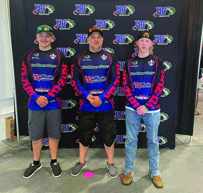 Eatonville's Tyler Kenney, Boat Captain Jason Kenney, and Cole Chadwick pose for a photo during the 2024 High School Fishing National Championship and World Finals in Anderson, South Carolina.