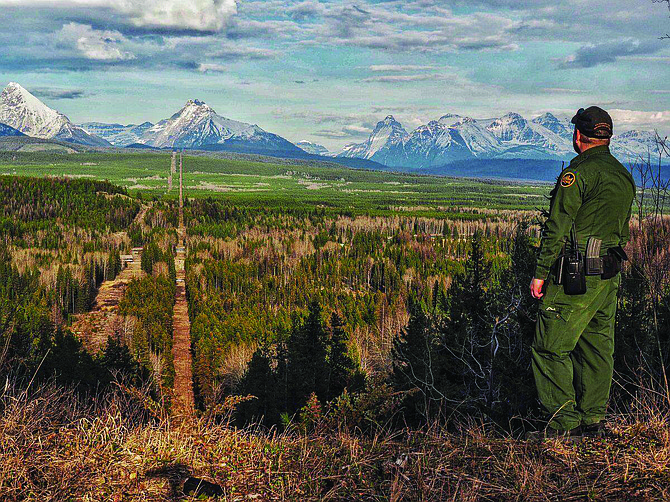 A Border Patrol agent standing watch at the Montana-Canada border in the CBP Spokane Sector. The Spokane Sector covers the U.S.-Canada border along the northwestern section of Montana, part of Idaho, and the eastern part of Washington.