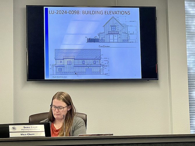 Carson City Planning Commission Vice-Chair Sena Loyd reviewing plans Wednesday for an accessory barn and commercial riding outfit off Alfred Way in west Carson City.
