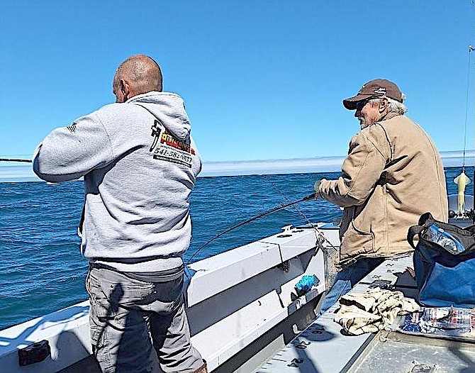 Doug Busey fishes for green lingcod off the Oregon coast.