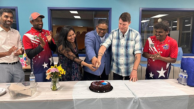 Key supporters of the Monroe Recreational Cricket League, including the hometown Monroe Warriors team (red jerseys), cut a celebratory cake together with Monroe Councilman/Mayor Pro Tem Kevin Hanford (in plaid shirt) for the opening of the third year of the Monroe Recreational Cricket League.
In attendance included Debadutta Dash, who is an official from the Consulate General of India.