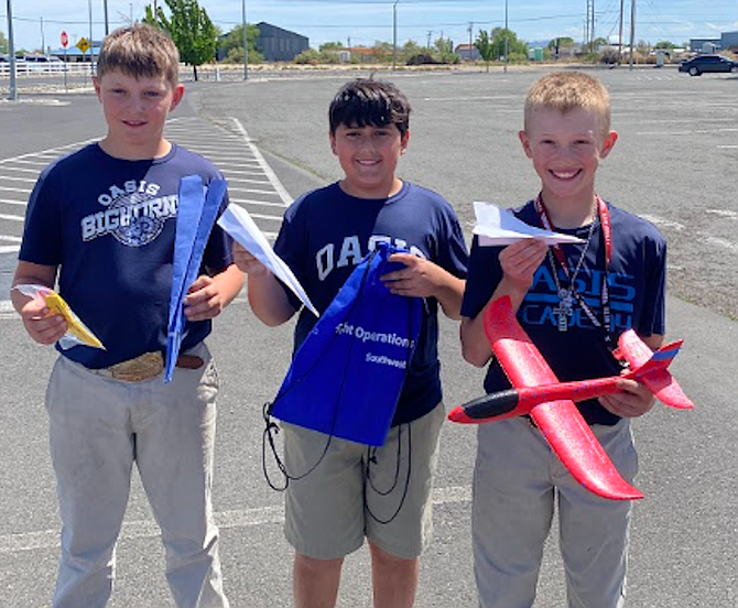 From left: Colton Fait, Antonio Garcia and Owen Wilson show their model airplanes.