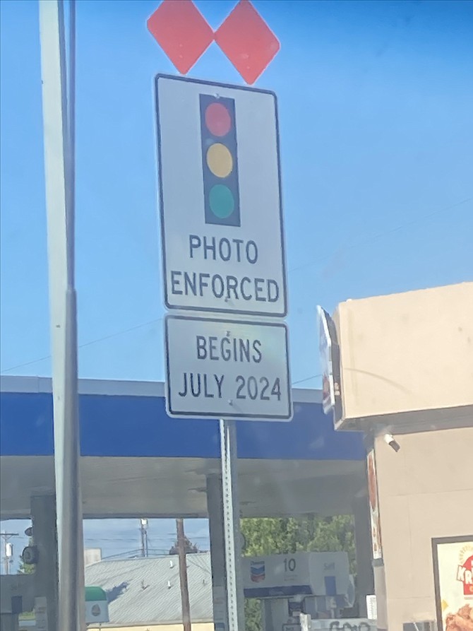 A warning sign at 41st Street and Rucker Avenue in Everett of red light enforcement cameras as seen July 3, 2024.
