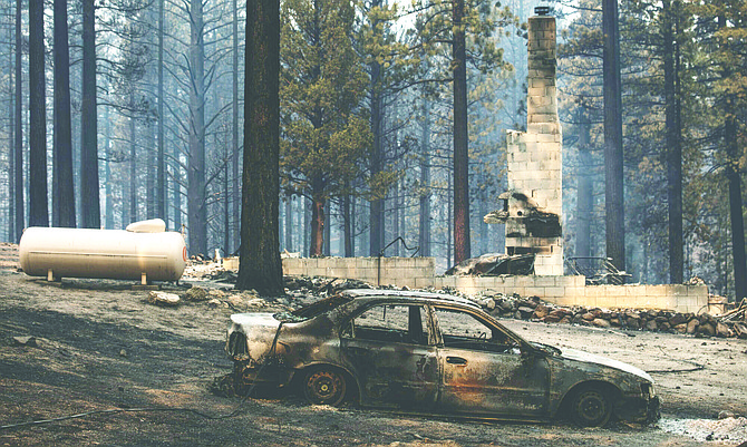 A destroyed home was in the path of the Tamarack Fire on Pleasant Valley Road in the evacuated town of Markleeville, Calif., on Saturday, July 17, 2021.