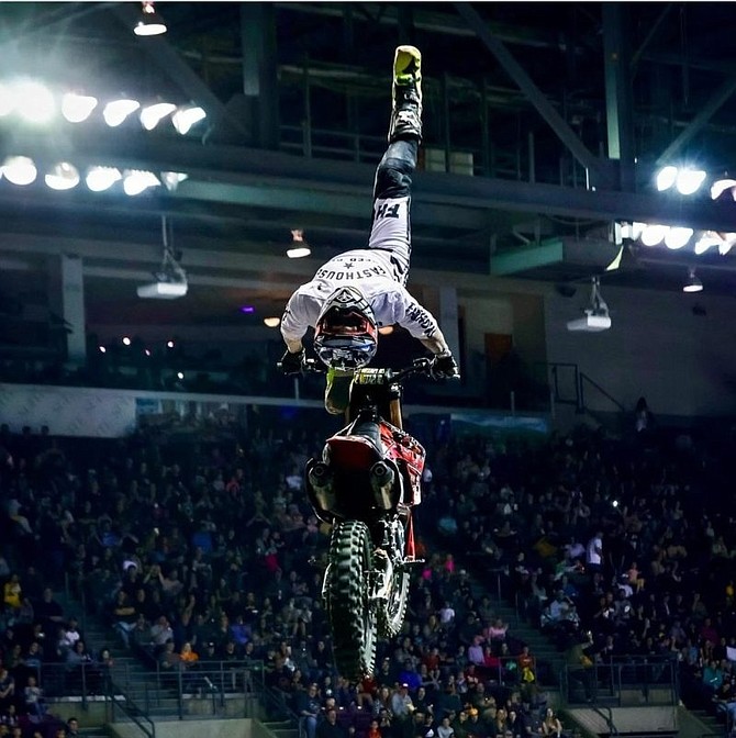 Matt Buyten soars through the air, during a motocross competition.