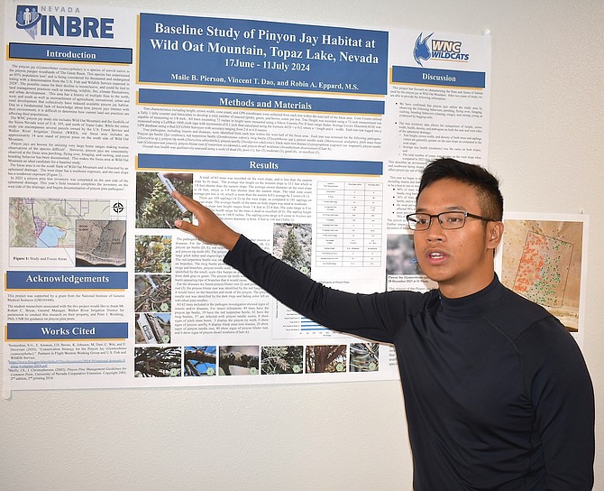 Western Nevada College graduate Vincent Dao presents about the Pinyon Jay habitat at Wild Oat Mountain near Topaz Lake during students’ research presentations July 15 at WNC.