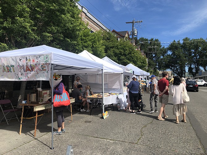 by Colleen Monette
Visitors enjoyed the first Magnolia Art Market of the season in June. 33rd Ave W, between W McGraw St and W Wheeler St.