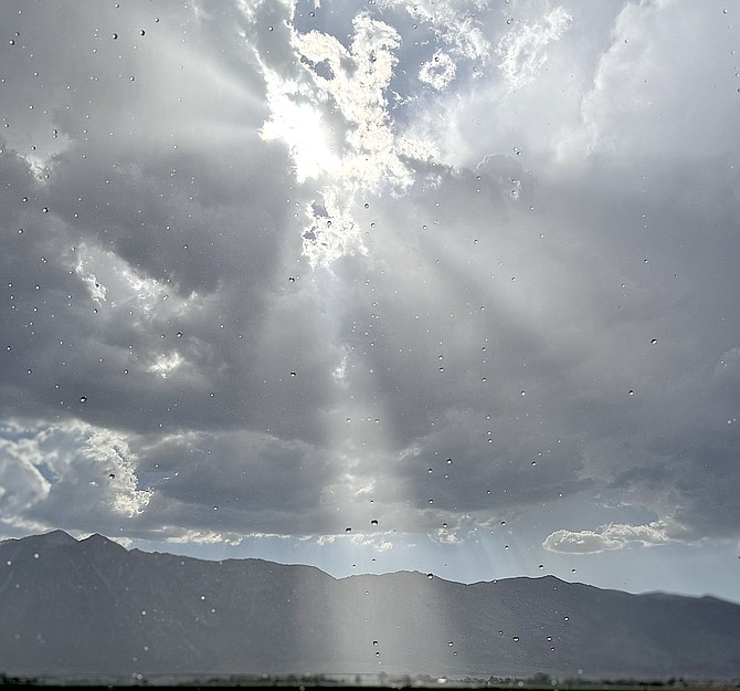 The sun pours through the clouds on Sunday during a thunderstorm that brought .6 inches of rain to the Gardnerville Ranchos. Photo special to The R-C by Michael Smith