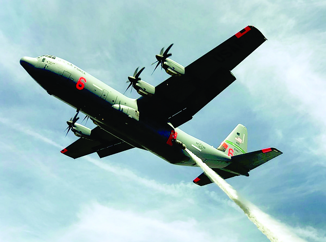 A Modular Airborne Fire Fighting System-equipped C-130J Super Hercules aircraft drops a line of water over the Tahoe National Forest, California, during a previous annual recertification and training.
US Air Force • Preston Schlachter