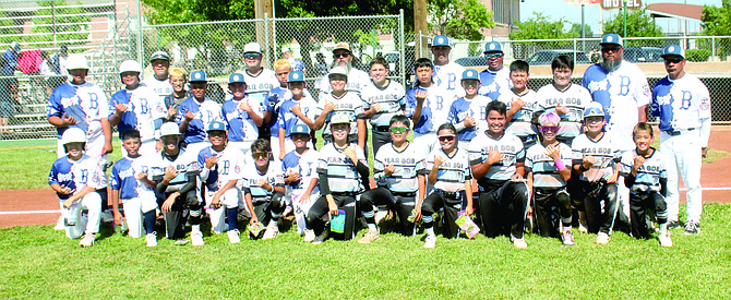 Both the Hawaii Kai and Oahu Bombers baseball teams show their camaraderie after Saturday’s 2024 Pacific Southwest Regionals for 11-year-olds at Fallon’s Oats Park. Hawaii Kai blanked the Bombers, 2-0.