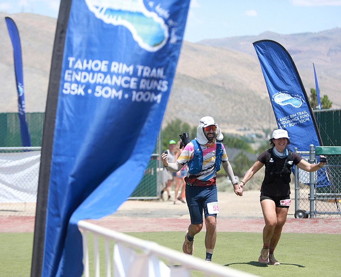 Ultra runner Simon Gerard celebrates as he finishes the 100-mile event in the Tahoe Rim Trail Endurance Run over the weekend. This year was the fourth WNC has been the host of the event.