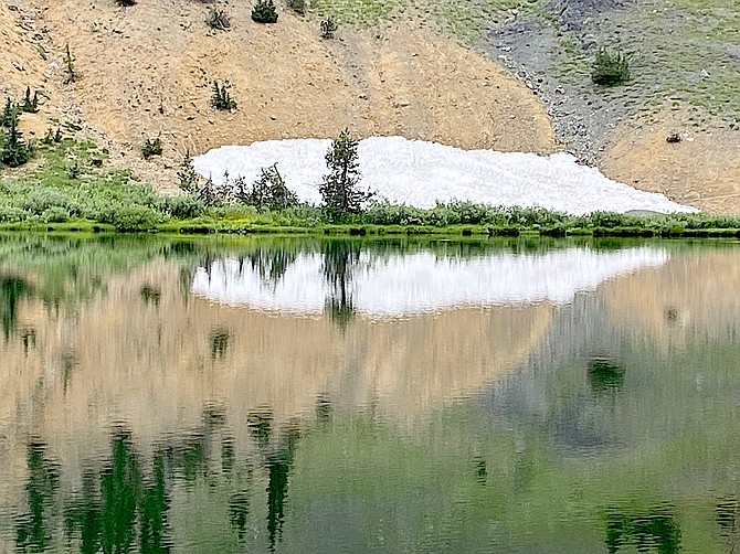 Carson Valley resident Sharon Calvert found a little patch of snow at Highland Lakes near Ebbetts Pass on Friday. She said it was around 70 degrees, but that the road is pretty rough.