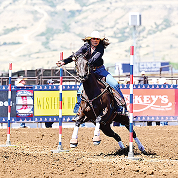 Humboldt County’s Emma Garijo makes a run in pole bending at the National High School Finals Rodeo in Rock Springs, Wyo. She finished 11th in the world.