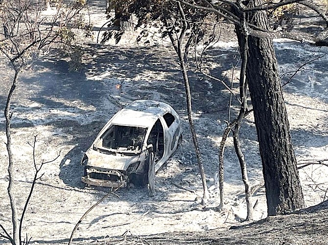 A vehicle that was allegedly burning when it was pushed into a gully, starting the Park Fire just north of Chico. Butte County District Attorney's Office