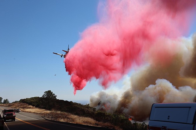 A tanker drops retardant on the Park Fire in this CalFire photo.