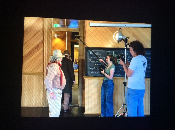 Directors Kyra Fields and Aiden Maher and actors Mike Duggan and Ross Mortensen filming a scene.