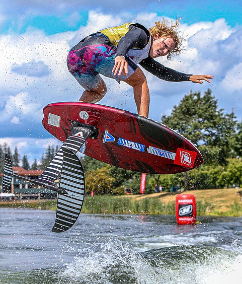 Noah Felgal, 27, from Lighthouse, Florida, rides a wake during the opening day of the Nautique WWA Wakeboard and WakeSurf National Championships on  July 25 on Lake Tye in Monroe in an up-close shot from the boat.
Felgal scored 91.67 points and took First Place in the Pro, Strapped, Foil Wake Surf event. 
”That was a really clean run,”  one of the judges in the boat said of Felgal’s work.
The small wake surf boards are fitted with a “foil” section at the base of a pylon so the surfer rides out of the water to perform their tricks.  The “strapped” description means the surfers feet are in foot straps on the board.
Beaux Wildman, from Warsaw, Indiana, scored 73.33 points for second place. John Ackerman, 30, from Deerfield Beach, Florida, took third with 68.33 points for this event.
The Nautique WWA Wakeboard and WakeSurf National Championships ran to Sunday. The tour has been coming to Lake Tye for one of its championship rounds for a few years now.